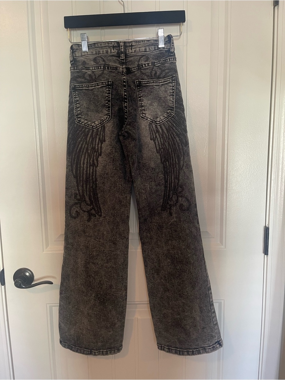 Black Acid-Wash Jeans with Embroidered Wing Design. juniors size 0 length 24